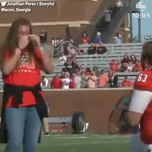SHE SAID YES: Georgia football player gets a little help from the stadium announcer as he proposes to his girlfriend on the field before his final college game. https://abcn.ws/2QWWF45 | ABC News