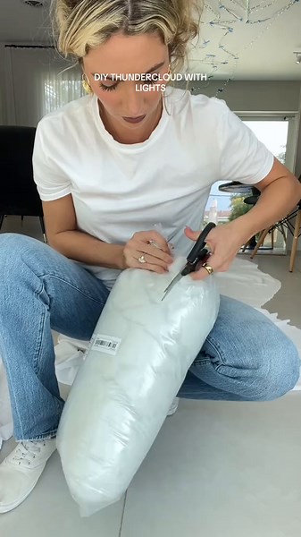 DIY THUNDERCLOUD WITH LIGHTS!!! This took me WAYYY longer than i thought i would and i almost ripped it down 3 times while sticking it to the ceiling but WORTH IT! Everyone loved this at the spooky party and cant wait to turn it on all through the spooky season and maybe even add more candles as i go! #diystormcloud #thundercloudwithlights #cloudlights #diy #halloweendecorations #diyhalloweendecorations