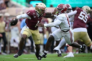 Florida State students rush the field after the Seminoles upset Alabama to open the 2025 season