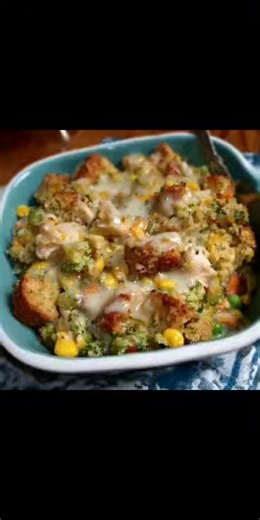 Stove top stuffing chicken pot pie One box of savory herb stove top stuffing One cup melted butter One to two pounds chicken breast cut into chunks Ranch seasoning mix One can cream of chicken herb condensed soup One can condensed broccoli and cheese soup One bag frozen mixed veggies Layer 8x8 deep dish Chicken chunks Mixed veggies Cover with one ranch packet or quarter cup Mix the soups together then pour over Stuffing mix Melted butter Drizzle with vegetable oil Bake on 350 for 45 55 minutes c