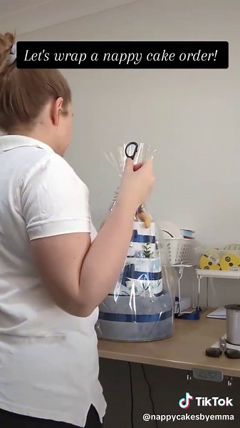 Watch me wrap this three tier nappy cake order for a new little bundle of joy called Oliver! 🎁 Check out this sped-up video to see how it all came together. 😍 It is definetly not this quick in real life! 💖 #babygiftidea #babyshower #giftwrapping #babygifts #diapercakes #nappycakes #nappycake #babygifthamper #nappycake #babygiftaustralia #babyshowergift #newmumgifts #smallbusiness #nappycakebrisbane #babygifting #giftwrappingideas #uniquebabygift