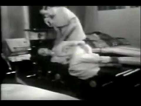 B.J. PALMER ADJUSTING ON DROP CLAY THOMPSON TABLE: CHIROPRACTIC HISTORY