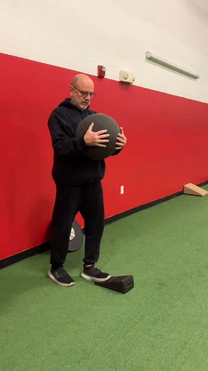 Split stance, B stance , staggered stance, call it what you want. I initially wasn’t a fan ( right Ariel) but have come around. I like the balance aspect of 1 Leg SLDL but like the ability to teach pelvis on femur rotation here. The bad part is this is a tough exercise to teach. Focus on the movement, not the load. | Michael Boyle's StrengthCoach.com