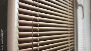 Window blind curtain open and close adjustment. The concept of home comfort.