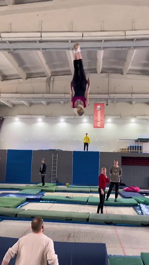 Gymnastics Training Session: Aerial Maneuvers and Coaching