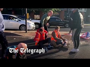 Insulate Britain activists pulled off the road by drivers, police and a paramedic