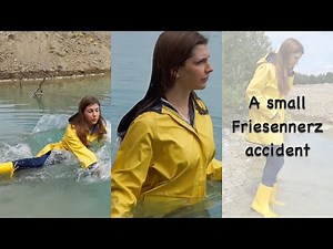 Girl with Friesennerz raincoat and rubber boots falling into the water - wetlook and wet clothes