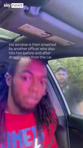 Window smashed and driver hit by police