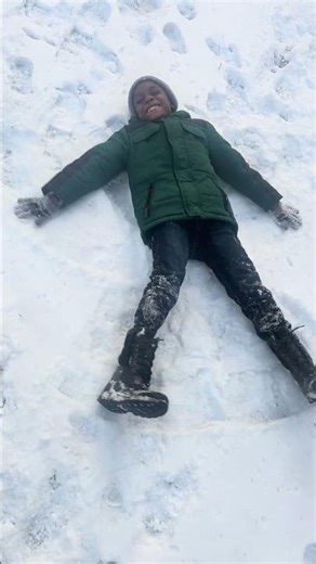 My baby making a snow angel . Took them out to play in the snow . #snowfall