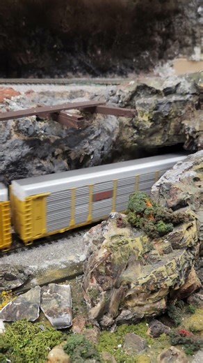 HO scale getting Pacific freight coming out of the tunnel.