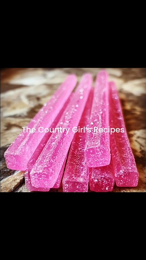Frosted Bubblegum Vodka Wands By The Country Girl’s Recipes Ingredients: - 1 cup bubblegum vodka - 1 cup pink lemonade - 1 tablespoon gelatin powder Directions: 1. In a small saucepan, combine the bubblegum vodka and pink lemonade over low heat. 2. Sprinkle the gelatin powder over the liquid mixture and stir continuously until the gelatin is fully dissolved. 3. Remove the saucepan from heat and let the mixture cool slightly. 4. Pour the liquid into wand-shaped silicone molds, filling them to the