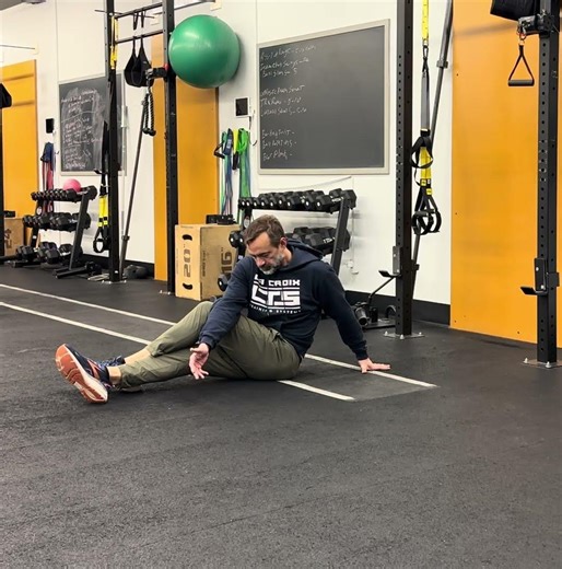 Seated spinal rotation crossover stretch