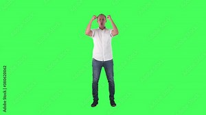 Ecstatic young fan celebrating goal screaming while watching match. Full body on green screen chroma key background.