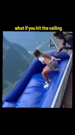 Zynox on Instagram: "The X post you linked (from @XCoolVideos) is a short video clip captioned **"what if you hit the ceiling"**. ### Video Description It shows a person sliding down an indoor inflatable slide that ends with a steep drop into a large ball pit filled with colorful plastic balls. The slider gains a lot of speed, launches off the end with high momentum, flies upward dramatically, and appears to nearly (or actually) collide head-first with the high arena ceiling before falling back 