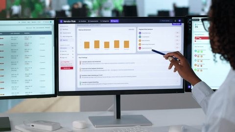 clip-4144228757-risk-manager-assessing-third-party-compliance-on-computer