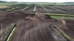Peat Harvester Tractor on Collecting Extracting Peat. Mining and harvesting peatland. Area drained of mire are used for peat extraction. Drainage and destruction of bogs. Peat harvesting.