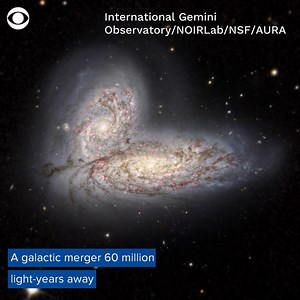 COSMIC COLLISION: In a part of space far, far away, two galaxies joined together to form one of the universe's most spectacular events – a galactic merger with streaming stars and chaos. And the stunning images are a preview of what's to come for the Milky Way. https://cbsn.ws/3PfFQhZ | CBS News