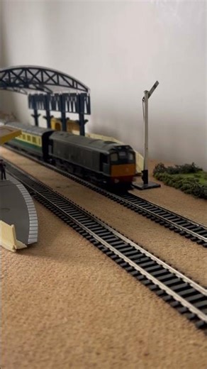British Rail Class 25 pulling 2 express coaches and passes through Tidmouth Station.