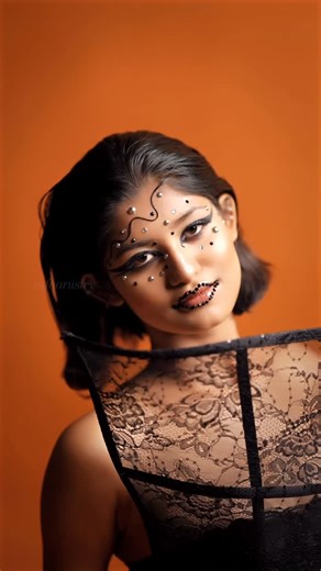 Asifa Irfan on Instagram: "Bold In Black 🖤 Smoky eyes with a bold twist Kept the skin clean and glowy, went heavy on the black smokey eye, and finished it off with some crystals and graphic details for a little extra edge. Simple base, dramatic eyes. that’s the vibe❤️ #asifaartistry #asifairfan #makeupartist"