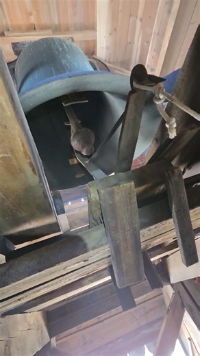 Unique undermounted tolling mechanism for 3700 pound bell #bell #churchbell #bellringing #fyp