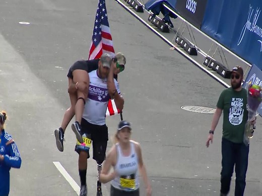 What an amazing moment at the Boston Marathon. A veteran with a prosthetic leg carries a woman across the finish line http://bit.ly/2pO0LgT | WESH 2 News