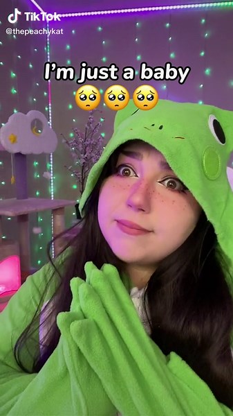 Peachy Baby Frog Finds Comfort in Cozy Spot