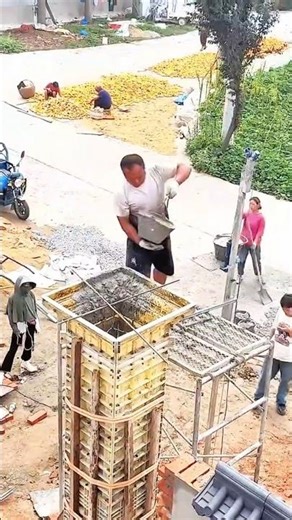 The process of pouring concrete into a column manually