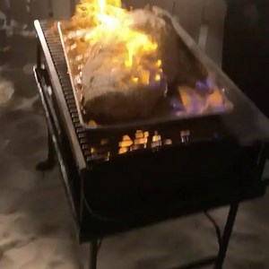 Now I know exactly how to cook 25 pound black grouper- wrap in parchment paper and flame while pouring liquor on top to add that extra bit of flair and danger! #themoreyouknow #caymancookout #rcmemories | The Points Guy