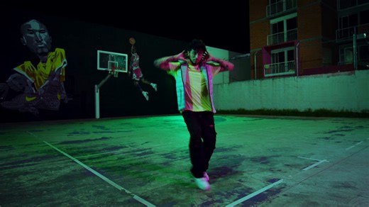 Boy dancing an animated choreography at night - Free Stock Video