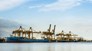 maritime transporting arrange container against sky