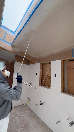 Spraying this shiplap ceiling with a spray gun extension so we can hit the whole ceiling from one side to the other. The homeowners chose flat urethane on the ceiling and walls. If this were your house, what finish would you use on shiplap — flat, eggshell, satin or semi-gloss? Vote in the comments 👇 #shiplap #ceilingpainting #urethane #sprayfinish #remodel #premiumpainting #painting #painter #pintores #pintura #paint | Jorge’s Painting LLC