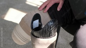 Preparing and fitting a bionic leg for a patient at a rehabilitation center. Healthcare, modern developments.