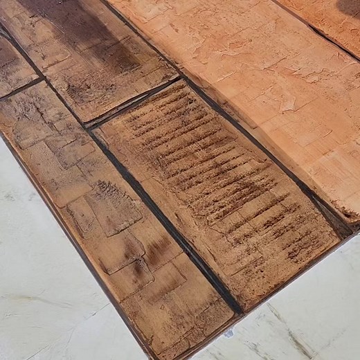 Staining a concrete overlay that was manipulated to look like wood plank that was cut with an axe. This is top of the line with by one of the best installers in the industry for concrete overlays Dan Lynch | New Jersey Decorative Concrete Supply
