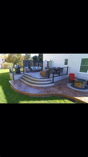 Your backyard deserves more than just a deck — it deserves a destination ✨ This custom low-maintenance deck with curved steps flows beautifully into a stamped patio and firepit lounge, creating the ultimate hangout spot. Ready to turn your backyard into a showpiece? 📲 Contact Kamholz Outdoor Living to start your design today. #KamholzOutdoorLiving #DeckGoals #OutdoorLiving #CustomDeck #DeckDesign #OutdoorOasis #DeckBuilders #BackyardInspo #BuffaloNY #LuxuryDeck #StampedConcrete #FirepitSeason #