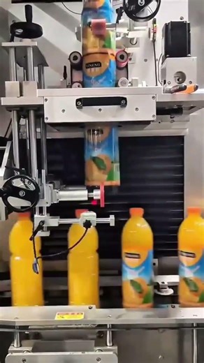 Applying Colorful Labels onto Orange Juice Bottles Using an Automatic Labeling Machine