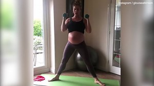 Gemma Atkinson displays baby bump while doing a home workout