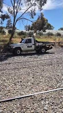 “When a 4x4 Hits the Rails! Aussie Hi-Rail Maintenance Vehicle in Action”
