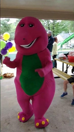 houston mascot party character purple dinosaur Barney marches at teddy bear park