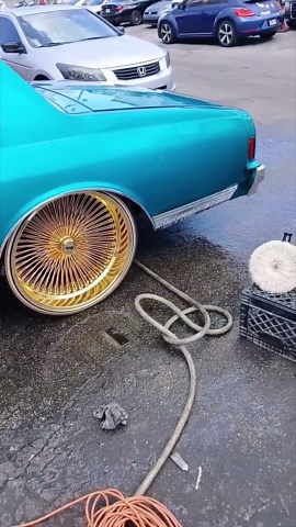 Candy Teal 2-Door Chevy Box on Gold 24’s Daytons