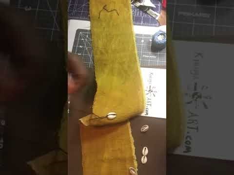How to sew cowrie shells on fabric