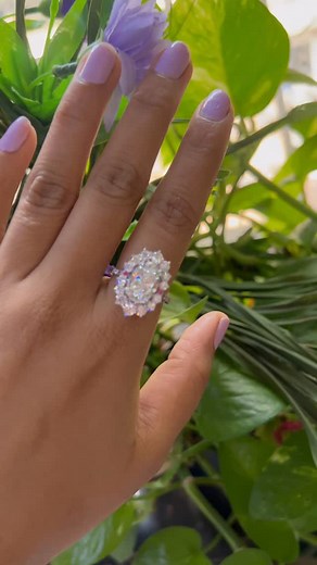 “This stunning halo ring adds the perfect touch of sparkle and elegance. With its shimmering stones and unique floral-inspired design, it’s a true statement piece that brightens every moment.” #luxuryring #haloring #statementring #sparklyjewelry #engagementringstyle #floralring #ovalcutring #shinebright #jewelrylove #blingmoment #giftforher #jewelryaddict #fashionjewelry #etsyjewelry #trendingjewelry | Cushionblue LLC