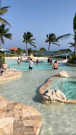 Looking for fun activities to do on your family vacation?Make the most of the pool when you're here. 🌞👙 - In-pool Volleyball net - 1st pool: front pool and hot tub - Swim-up pool bar for adults - 2nd pool: Adventure deeper pool - Rock tunnel water slide #resortfun #barefootluxury #cocobeachbelize #vacatioindays #fun #familytravel #beachresort #ambergriscaye | Coco Beach Resort Belize