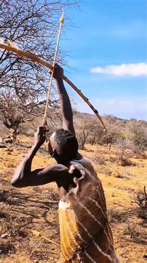 African Hunter Spots a Mongoose on a Tree and Strikes with an Arrow. 🏹🌿#shortvideo #wildlife