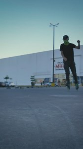 Urban boy with roller skates sliding and spinning in a parking lot - Free Stock Video
