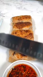 Rice paper dumplings by dr vegan In a large pan sauté -2 spring onions, chopped -2 carrots, shredded -1/4 white cabbage, shredded -7 oz mushrooms -1 tbsp ginger, grated -1 block tofu (7oz) In some oil for a few mins until the veggies start to soften, then add -2 tbsp soy sauce -1 tbsp rice vinegar 1 tbsp corn starch Stir and set aside. In the meantime, prepare the dipping sauce. To a heat proof bowl add -2 tbsp chili flakes -1 tbsp Sichuan pepper -1 tbsp sesame seeds -1 garlic clove, minced -2 t