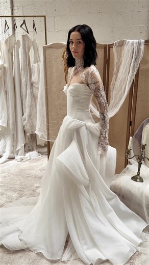 SALOMÉ | A bridal look so romantic, it’s impossible to resist. The sculptural train and sleek bodice create a silhouette that captivates at every angle. Layered with the French lace of the IVY JACKET, this gown is perfect for the bride who adores timeless details with a modern edge. Would you say “Yes” to SALOMÉ? Let us know in the comments below x #SaintBridal #WeddingDress #IvyJacket #BridalShop #Bridetobe