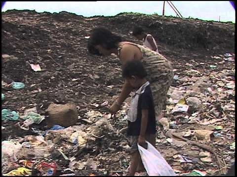 Smokey Mountain in Manila- sorting trash for metals & plastics to sell