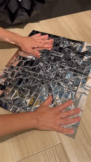D.Hinklay on Instagram: "Folding reflective sheet into geometric forms. Origami; Prop 4(Reflective sheet) I made it from a piece of paper and didn’t cut any part of paper to create it. I designed it by myself. #origami #geometric #asmr #折り紙 #reflection #silver"