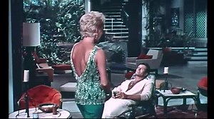 Oscar-winning costume designer Edith Head presents costume tests for Lana Turner and Stefanie Powers for the film "Love Has Many Faces" (1965). | Midcentury Fashion