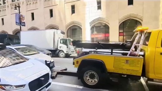 Video shows truck trying to tow car with driver inside